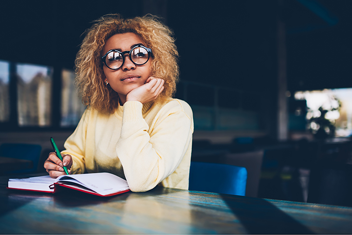 woman taking notes